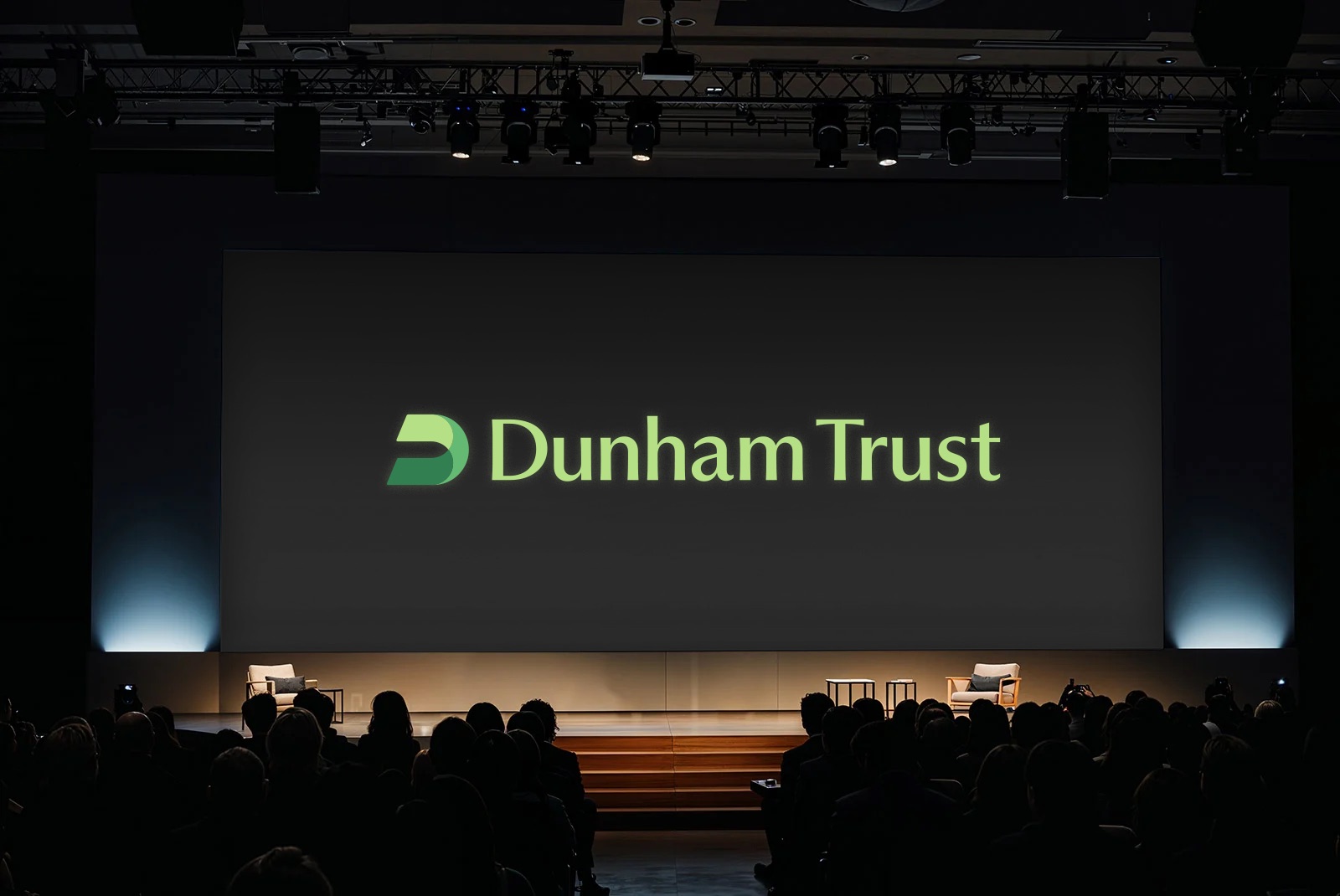 Dunham Trust on a conference stage screen