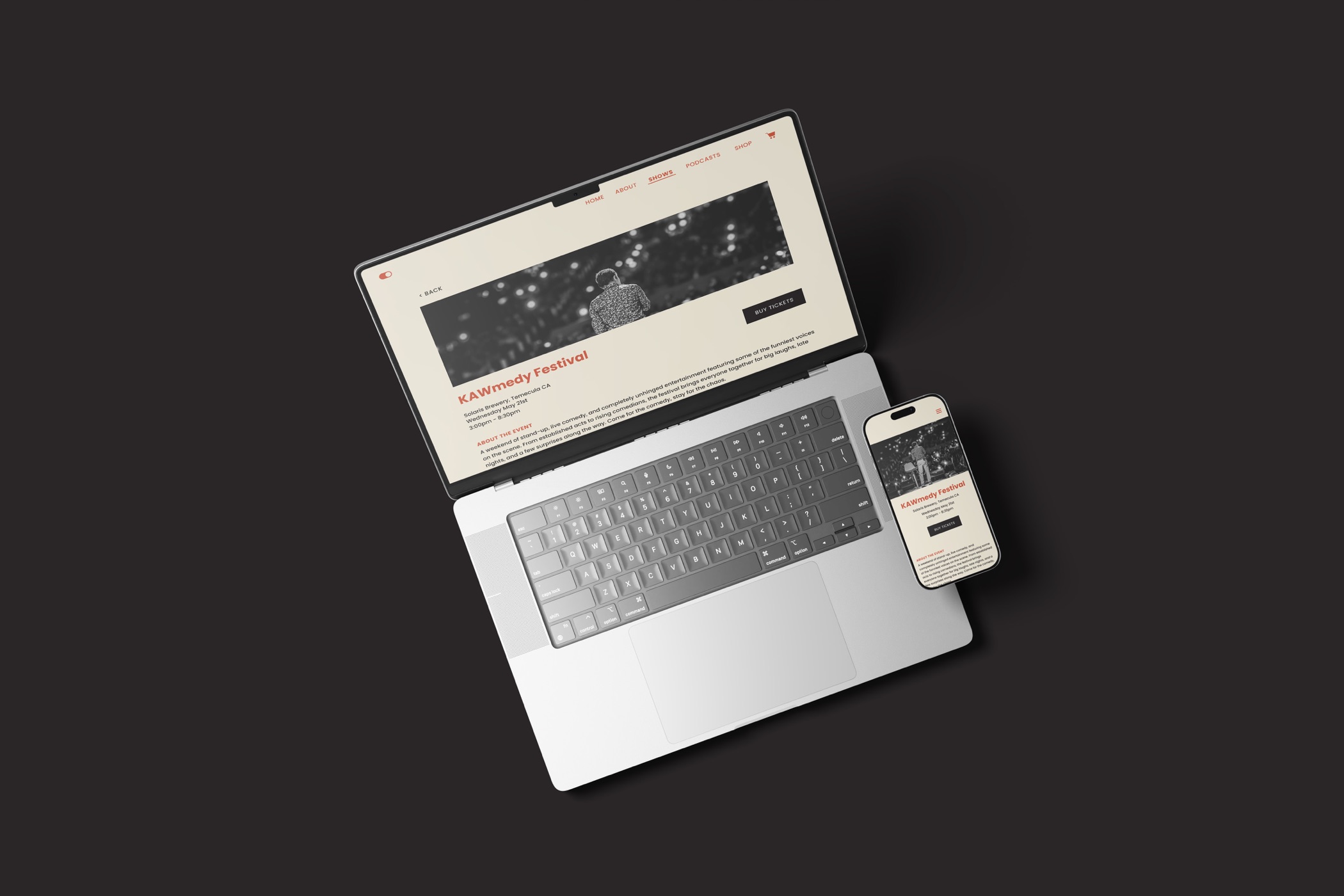 KAWmedy event page on a laptop and phone, seen from above