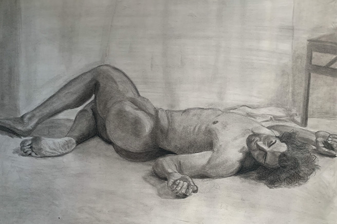charcoal drawing of man on floor
